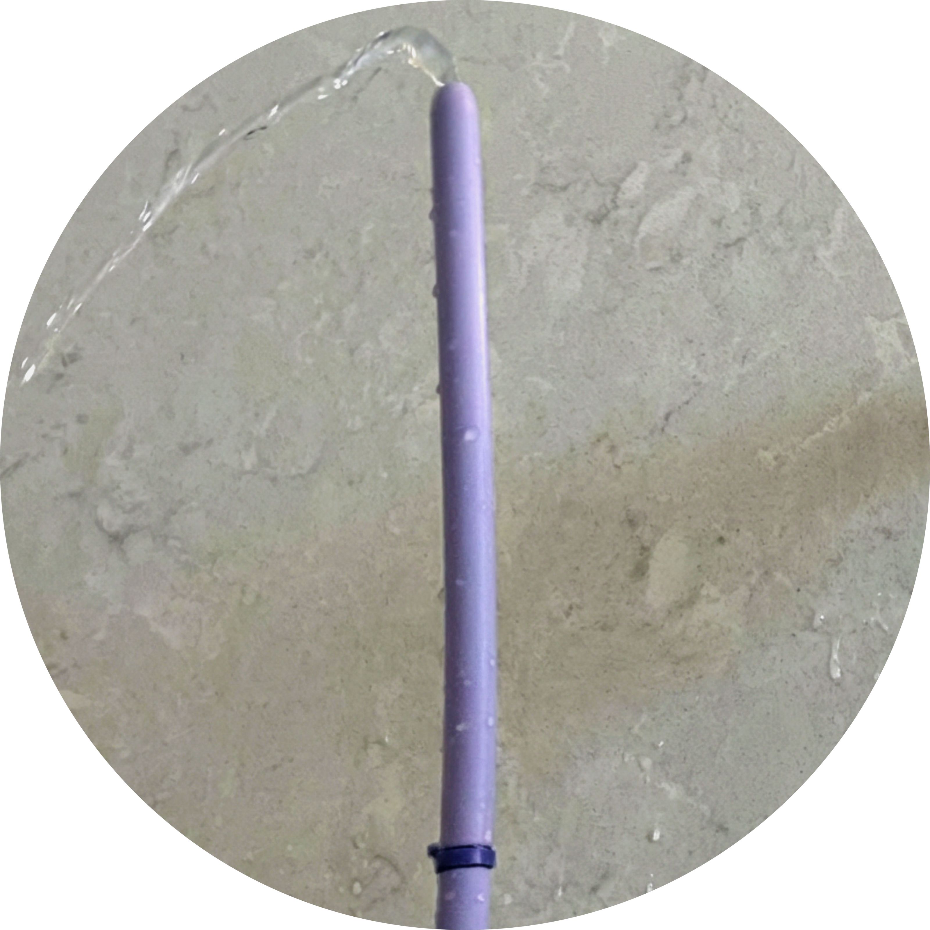 Close-up of Squwash platinum-cured medical-grade silicone tip held vertically with water flowing through